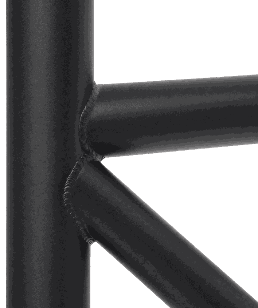 Close view of a welded joint on a powder-coated tubular steel frame, showing the weld bead where three tubes meet
